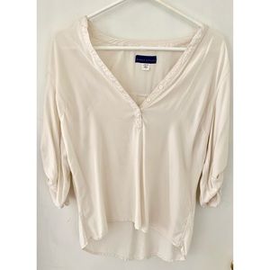 Cream color half sleeve blouse.